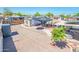A large backyard features gravel and multiple areas with patios and seating at 2221 W Mitchell Dr, Phoenix, AZ 85015