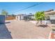 Large backyard with a pergola, hot tub, and gravel landscaping at 2221 W Mitchell Dr, Phoenix, AZ 85015