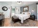 Bedroom featuring a well-decorated space with a comfy bed, stylish rug, and plenty of natural light at 2221 W Mitchell Dr, Phoenix, AZ 85015