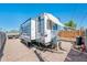 RV parked in a gravel yard with an open awning at 2221 W Mitchell Dr, Phoenix, AZ 85015