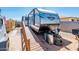 RV parked with ramp access in a gravel yard at 2221 W Mitchell Dr, Phoenix, AZ 85015