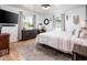 Bright bedroom with natural light from large windows and stylish decor throughout the space at 2221 W Mitchell Dr, Phoenix, AZ 85015