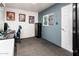 Bright home office featuring modern decor, ample desk space, and natural light at 2221 W Mitchell Dr, Phoenix, AZ 85015