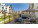 Relaxing balcony with cushioned seating and views of the landscaped community at 2511 W Queen Creek Rd # 166, Chandler, AZ 85248