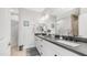 Bathroom featuring dual sinks, dark countertops, and modern fixtures at 2511 W Queen Creek Rd # 166, Chandler, AZ 85248