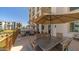 Inviting outdoor dining area in community with umbrellas, tables, and well-maintained landscaping at 2511 W Queen Creek Rd # 166, Chandler, AZ 85248