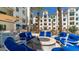 Inviting outdoor firepit and lounge area with comfortable seating and barbecue grills in a stylish community setting at 2511 W Queen Creek Rd # 166, Chandler, AZ 85248