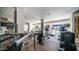 Modern gym with Life Fitness equipment, including treadmills and weight machines, and bright natural light at 2511 W Queen Creek Rd # 166, Chandler, AZ 85248