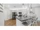 Modern kitchen featuring stainless steel appliances, gray countertops, and hardwood floors at 2511 W Queen Creek Rd # 166, Chandler, AZ 85248