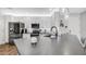 Bright kitchen with stainless steel appliances, quartz countertops, and white cabinetry at 2511 W Queen Creek Rd # 166, Chandler, AZ 85248