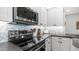 Modern kitchen with stainless steel appliances, gray countertops, and stylish backsplash at 2511 W Queen Creek Rd # 166, Chandler, AZ 85248