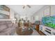 Open-concept living area showcases hardwood floors, neutral decor, and seamless flow to kitchen and dining at 2511 W Queen Creek Rd # 166, Chandler, AZ 85248