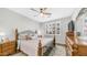 Comfortable main bedroom with a ceiling fan, ample natural light and hardwood floors at 2511 W Queen Creek Rd # 166, Chandler, AZ 85248