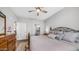 Spacious main bedroom with hardwood floors, neutral tones, and ensuite bathroom access at 2511 W Queen Creek Rd # 166, Chandler, AZ 85248