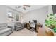 Bright home office with a comfortable gray sofa chair and a wood desk with white office chair at 2511 W Queen Creek Rd # 166, Chandler, AZ 85248