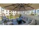 Inviting patio space with comfortable outdoor furniture, umbrella, and scenic views of the community at 2511 W Queen Creek Rd # 166, Chandler, AZ 85248