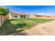 Expansive backyard with a lush green lawn, providing ample space for outdoor activities at 259 E Montego Dr, Casa Grande, AZ 85122