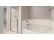 Bathroom featuring a bathtub and separate glass shower enclosure at 259 E Montego Dr, Casa Grande, AZ 85122