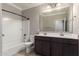Bathroom featuring double sinks, a bath tub, and a full mirror above the vanity at 259 E Montego Dr, Casa Grande, AZ 85122