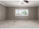 Bedroom with a large window with shutters providing natural light at 259 E Montego Dr, Casa Grande, AZ 85122