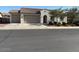 Charming single-story home with a well-maintained front yard and a spacious three-car garage at 259 E Montego Dr, Casa Grande, AZ 85122