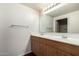 Well-lit bathroom with a double vanity, ample cabinet space, and a large mirror, offering convenience and style at 295 N Rural Rd # 160, Chandler, AZ 85226