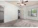 Bright carpeted bedroom with ceiling fan and ensuite bathroom and walk in closet at 295 N Rural Rd # 160, Chandler, AZ 85226