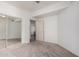 Neutral bedroom with carpet, a sliding-door closet, and bright walls, providing a blank canvas for personalization at 295 N Rural Rd # 160, Chandler, AZ 85226