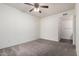 Neutral bedroom with carpet, ceiling fan, and ensuite bathroom at 295 N Rural Rd # 160, Chandler, AZ 85226