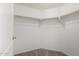 Spacious walk-in closet with carpeted flooring and metal hanging racks and shelving at 295 N Rural Rd # 160, Chandler, AZ 85226