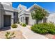 Inviting townhouse exterior with well-maintained landscaping and walkways leading to private entrances at 295 N Rural Rd # 160, Chandler, AZ 85226