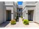 Close-up of townhouses featuring private entrances and well-manicured landscaping for a welcoming feel at 295 N Rural Rd # 160, Chandler, AZ 85226
