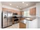 Efficient kitchen with stainless steel appliances, granite countertops, and ample cabinet space at 295 N Rural Rd # 160, Chandler, AZ 85226