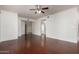 Spacious living room with hardwood floors, a ceiling fan, and neutral walls, offering a versatile living space at 295 N Rural Rd # 160, Chandler, AZ 85226