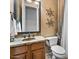 Bathroom with granite countertops, undermount sink, and decorative artwork at 32020 N 20Th Dr, Phoenix, AZ 85085