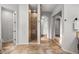 Spacious bathroom featuring tiled walk-in shower and large mirrored closet at 32020 N 20Th Dr, Phoenix, AZ 85085