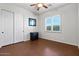 Bedroom featuring a window with shutters and double door closet at 32020 N 20Th Dr, Phoenix, AZ 85085