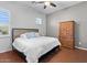 Cozy bedroom with a ceiling fan, natural light, and traditional furniture at 32020 N 20Th Dr, Phoenix, AZ 85085