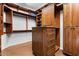 Organized walk-in closet with custom shelving and drawers for storage at 32020 N 20Th Dr, Phoenix, AZ 85085