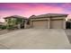 Charming single-story home featuring a three-car garage and low-maintenance desert landscaping at 32020 N 20Th Dr, Phoenix, AZ 85085