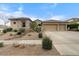 Charming single-story home featuring a three-car garage and low-maintenance desert landscaping at 32020 N 20Th Dr, Phoenix, AZ 85085