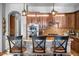 Kitchen featuring stone accents, granite countertops, stainless steel appliances, and island with seating at 32020 N 20Th Dr, Phoenix, AZ 85085