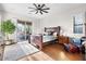 Serene main bedroom with wood floors, large windows, and access to outdoor patio at 32020 N 20Th Dr, Phoenix, AZ 85085
