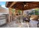 Outdoor kitchen and fireplace offer a great entertaining space at 32020 N 20Th Dr, Phoenix, AZ 85085