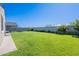 Spacious backyard featuring lush green lawn, perfect for outdoor activities at 32729 N Mach Ln, San Tan Valley, AZ 85143