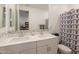 Modern bathroom featuring double sinks, a mosaic backsplash, a toilet, and shower with curtain at 32729 N Mach Ln, San Tan Valley, AZ 85143