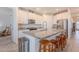 Bright kitchen featuring granite counters, stainless steel appliances, and eat in island at 32729 N Mach Ln, San Tan Valley, AZ 85143