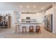 Spacious open concept kitchen with large center island and seating for four at 32729 N Mach Ln, San Tan Valley, AZ 85143