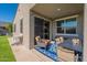 Relaxing covered patio with seating area, blue rug, and great backyard views at 32729 N Mach Ln, San Tan Valley, AZ 85143