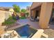 Enjoy this private backyard with a small pool, patio area and low maintenance turf at 3581 S Arizona Pl, Chandler, AZ 85286